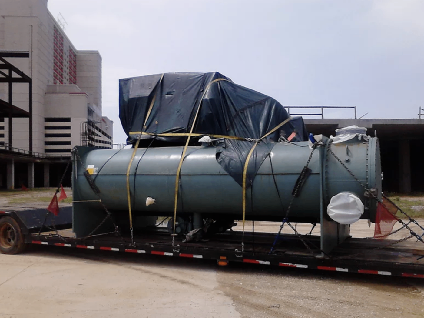 Decommissioned industrial water chiller unit staged outdoors before pickup